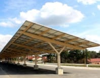 A large solar panel sitting under a parking lot.